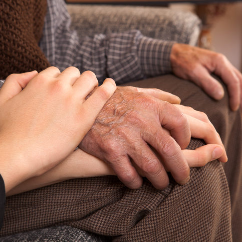 Grandfather and grandson holding hands